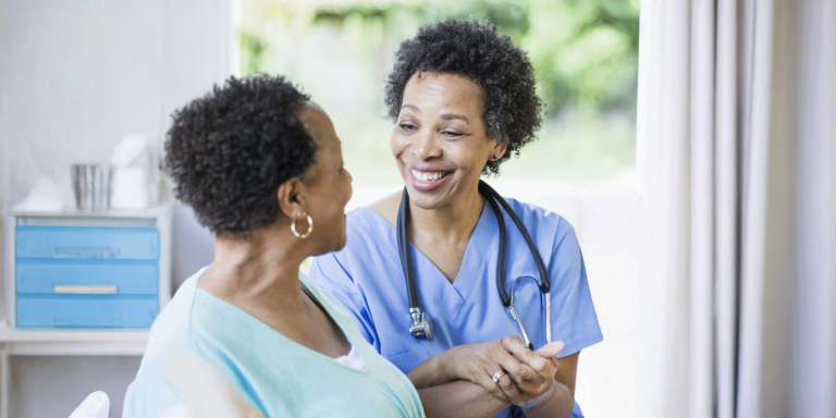 Nurse supporting senior patient in coordinated healthcare setting